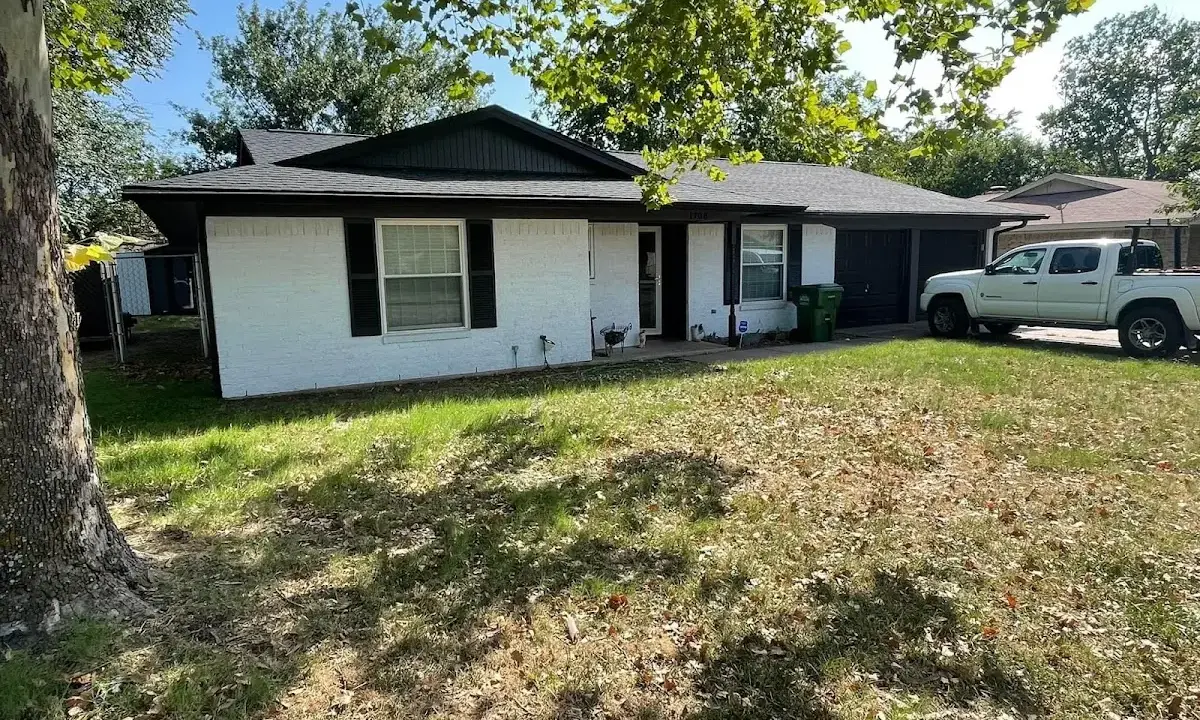 Professional roofing crew working on a residential roof in Doney Park